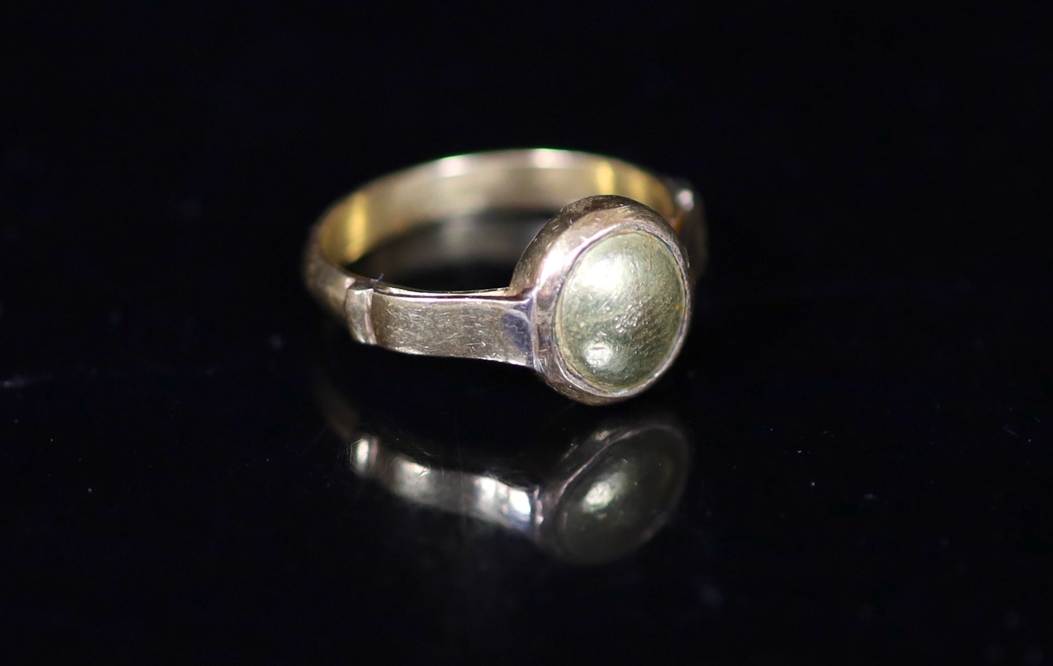 An antique gold ring, the centre now with gold? (ex gemstone) insert